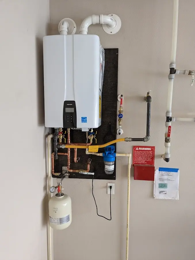 Professional plumber installing copper piping in a Casa Grande home